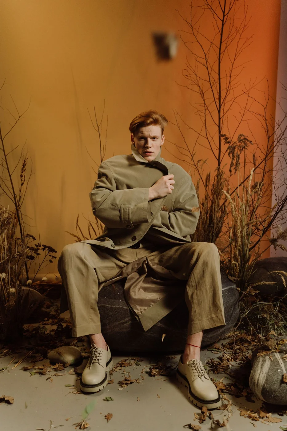 Man wearing a belted trench coat
