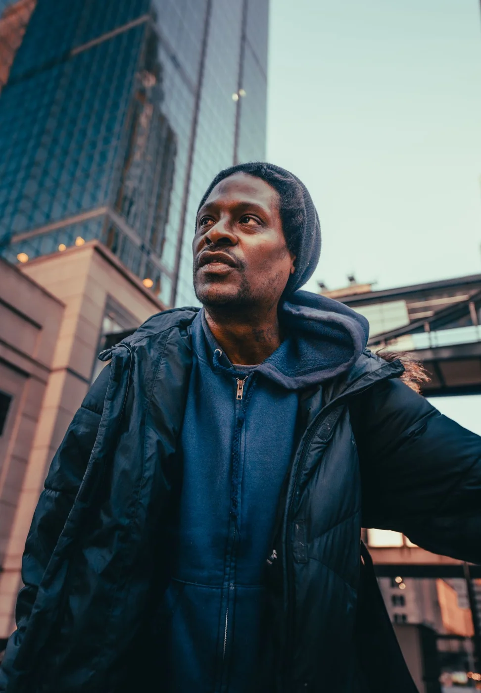 Low-Angle Shot of a Man Wearing Black Puffer Jacket