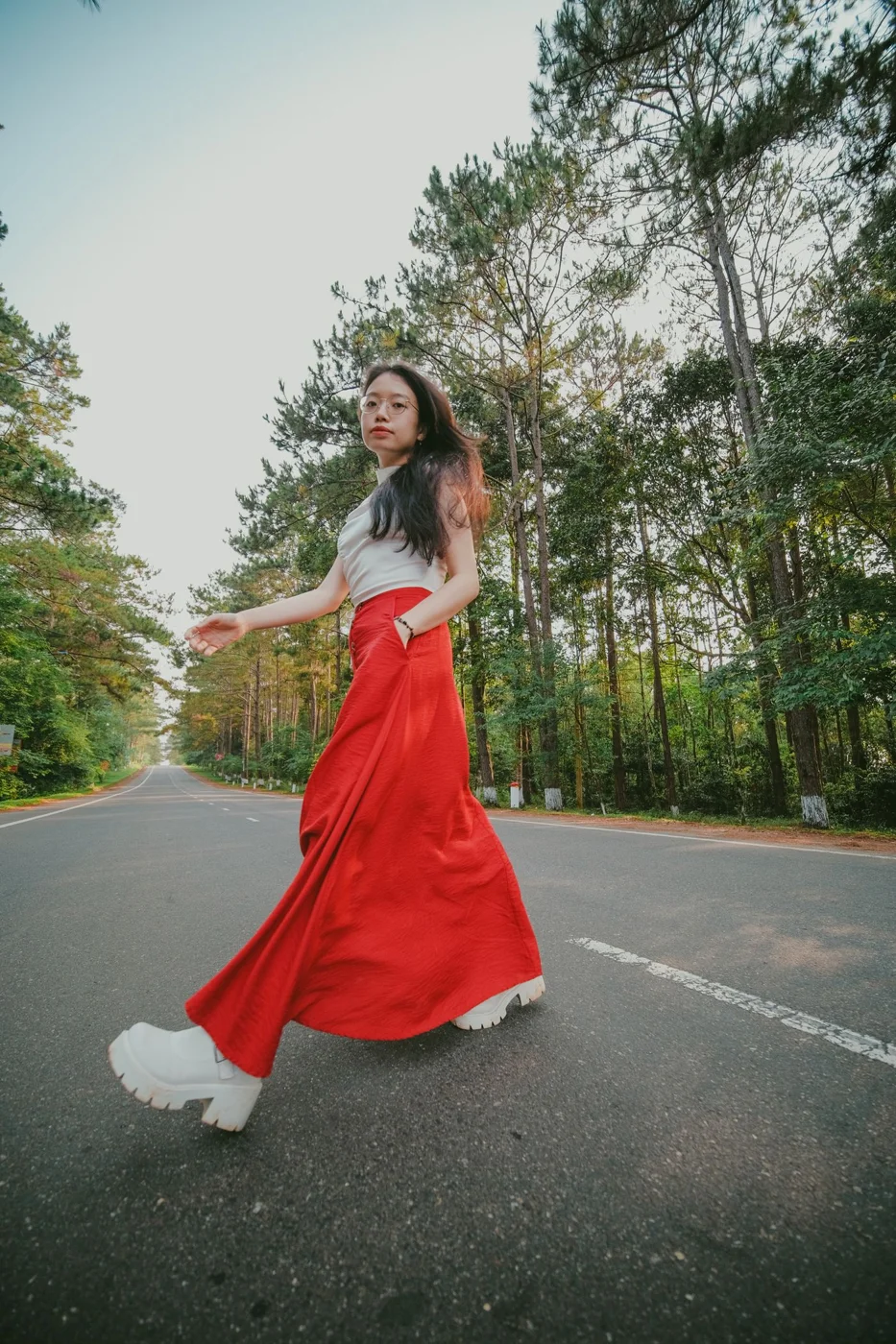 Woman wearing a long satin skirt