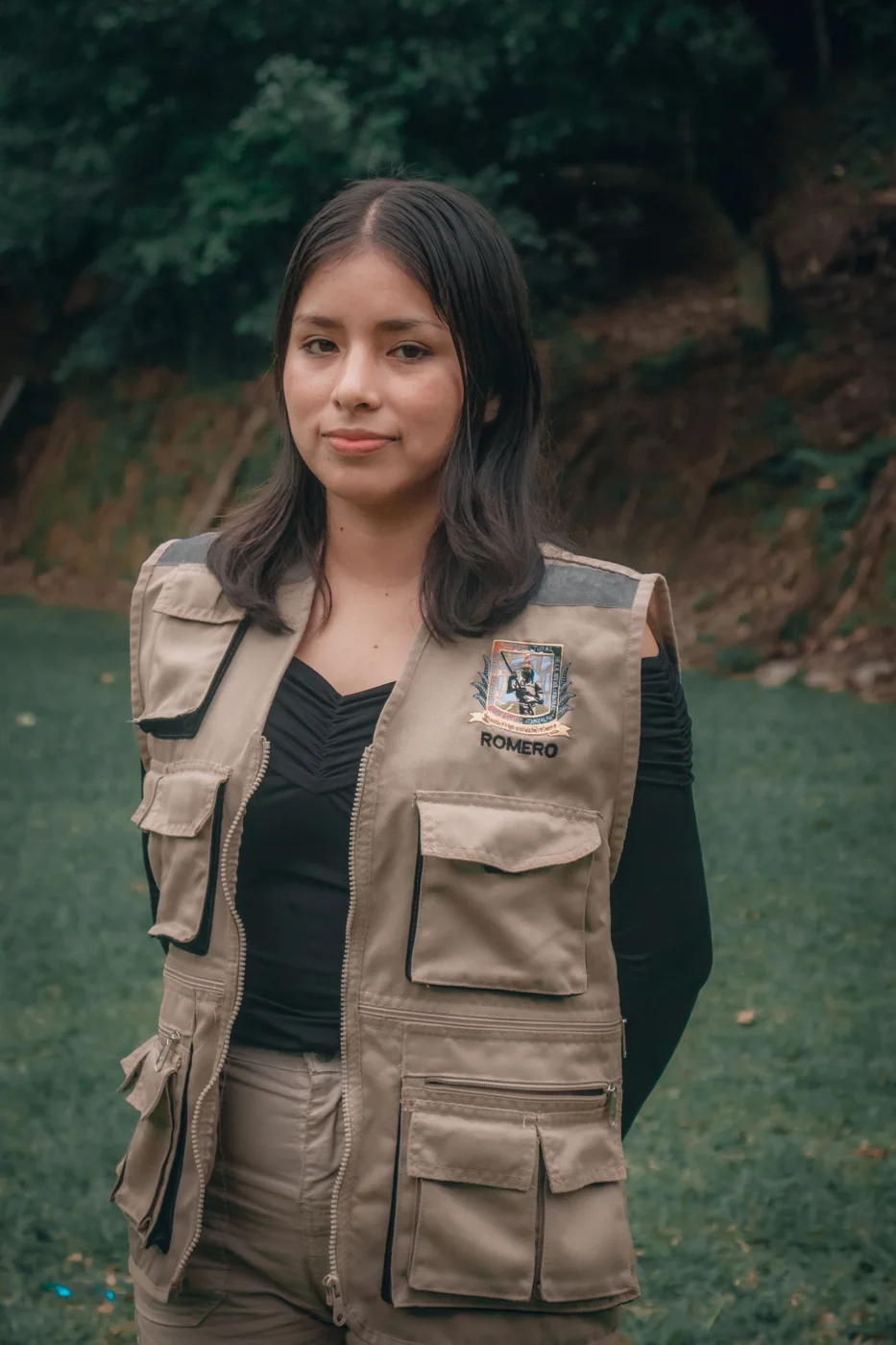 Young Woman in Outdoor Setting Wearing a Vest
