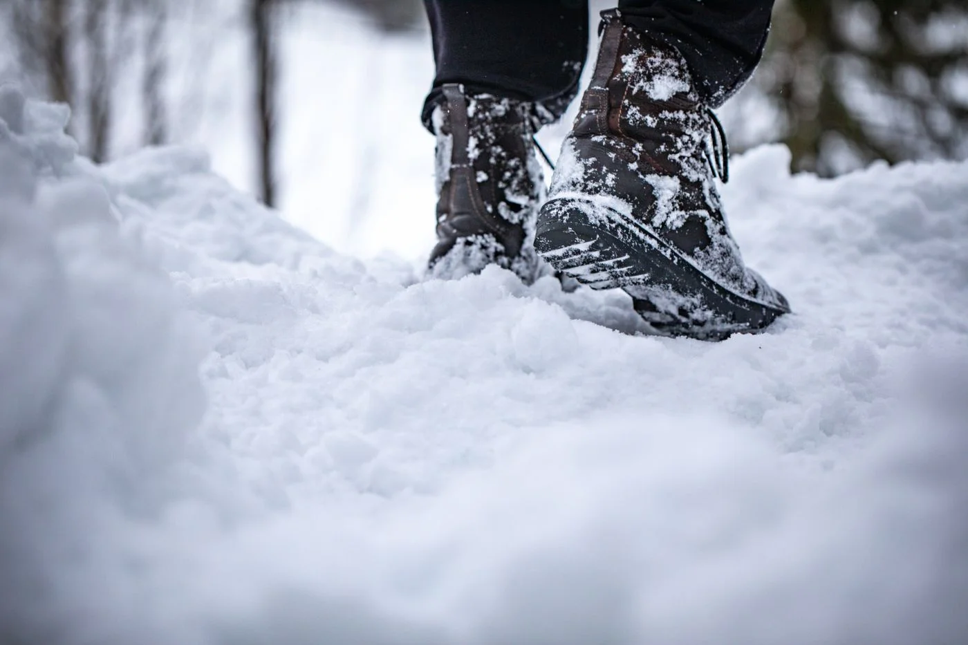 Winter Boots Walking Through Fresh Snow