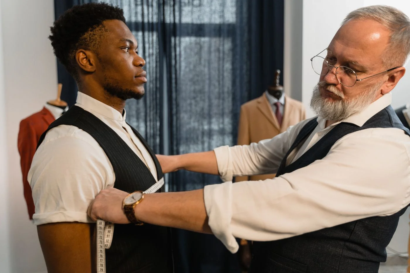 Tailor Measuring a Client's Chest