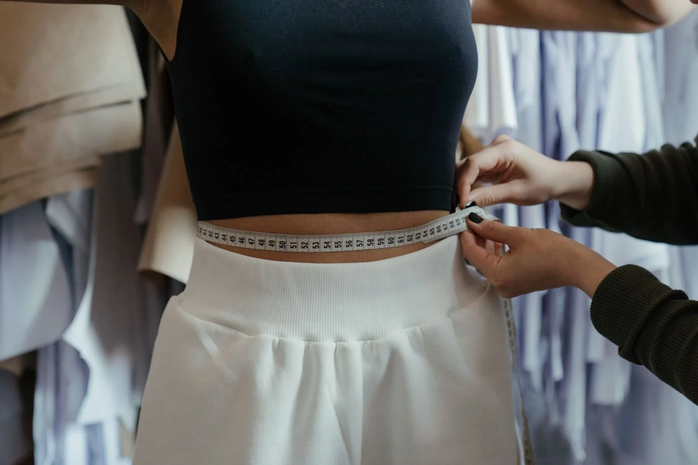 Measuring tape used to check a garment fit at the waist